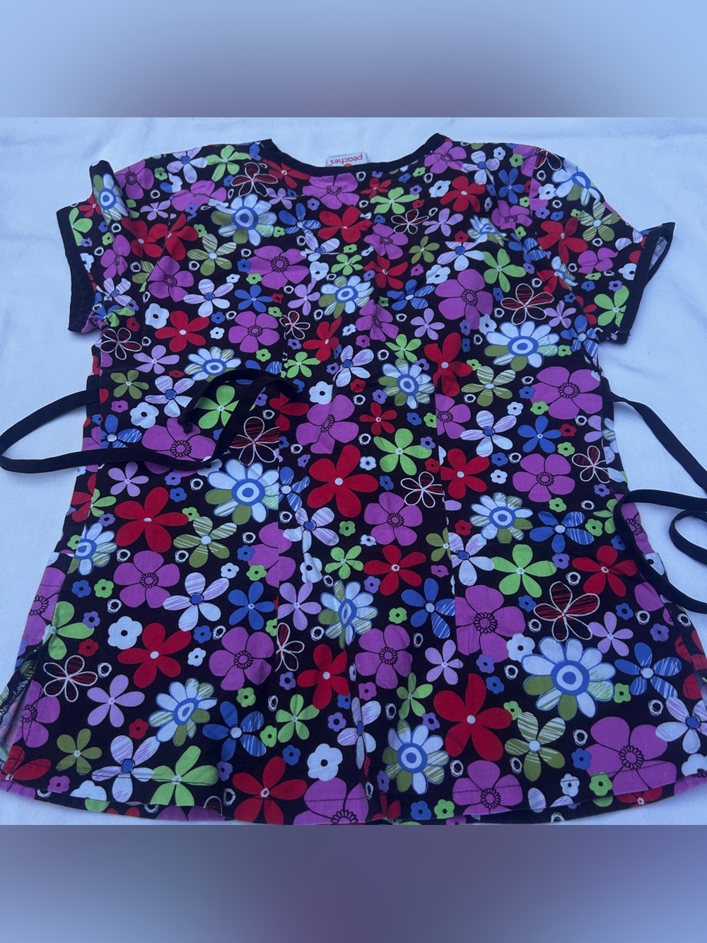 Peaches Uniforms Black Floral Nursing Scrub Top with Bright Blooms